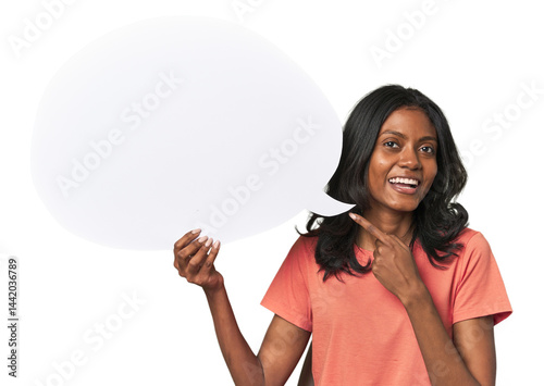 Indian woman with dialogue bubble smiling and pointing aside, showing something at blank space.