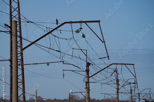 Obraz na płótnie wires on a high-voltage power line next to the railway, spring day w salonie