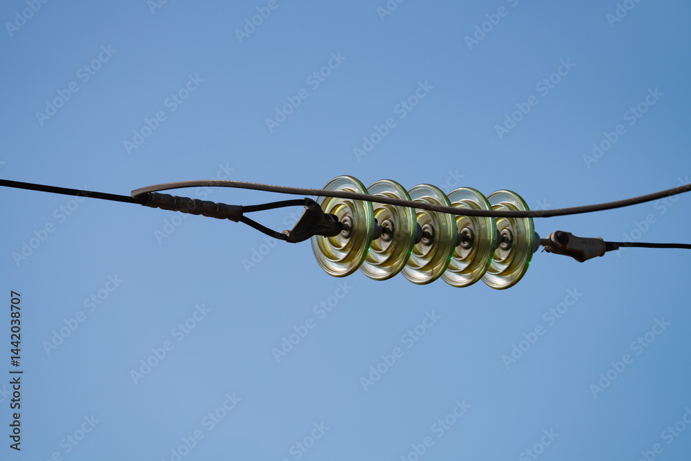 wires on a high-voltage power line next to the railway, spring day