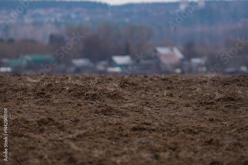 Obraz na płótnie a plowed agricultural field , a spring landscape in the countryside w salonie