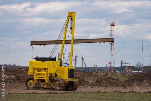 Obraz na płótnie construction equipment on the section of the highway, laying of an underground gas pipeline w salonie