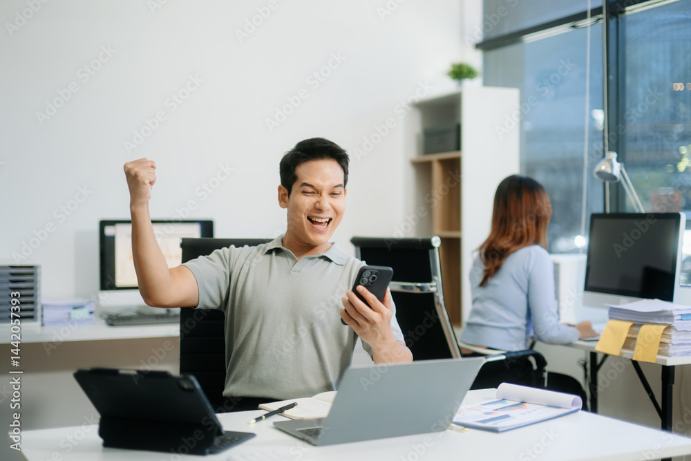 Asian businessman are delighted and happy with the work they do on their tablet, laptop and taking notes Asian businessman are delighted and happy with the work they do on their tablet, laptop and taking notes