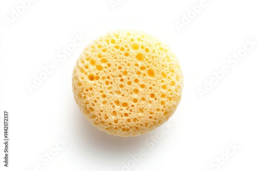 Soft yellow bath sponge close up textured surface round shape spa product body care clean