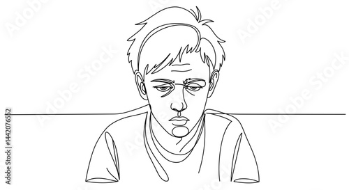 Young man showing boredom while sitting at a table  