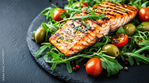 Obraz na płótnie Grilled Salmon Delight: A culinary masterpiece features a perfectly grilled salmon fillet, artfully presented with fresh arugula, ripe tomatoes, and green olives. w salonie