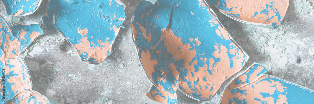Peeling paint on the wall. Old concrete wall with cracked flaking paint. Weathered rough painted surface with patterns of cracks and peeling. High resolution texture for background and design. Closeup