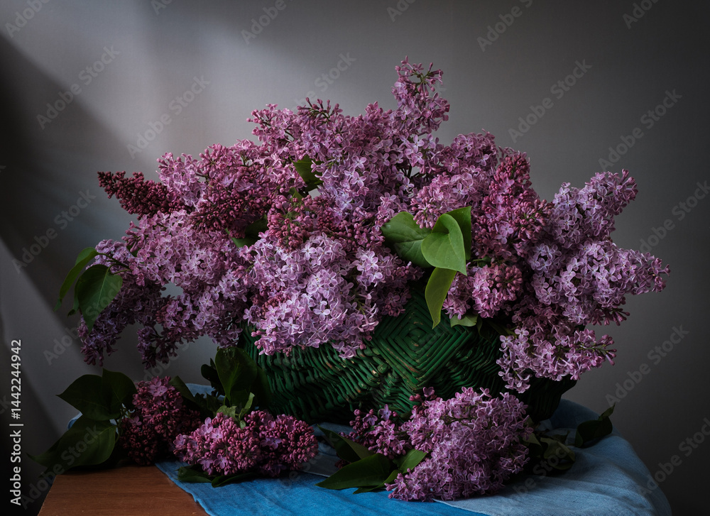 A Beautiful and Vibrant Lilac Bouquet arranged in a Wicker Basket.