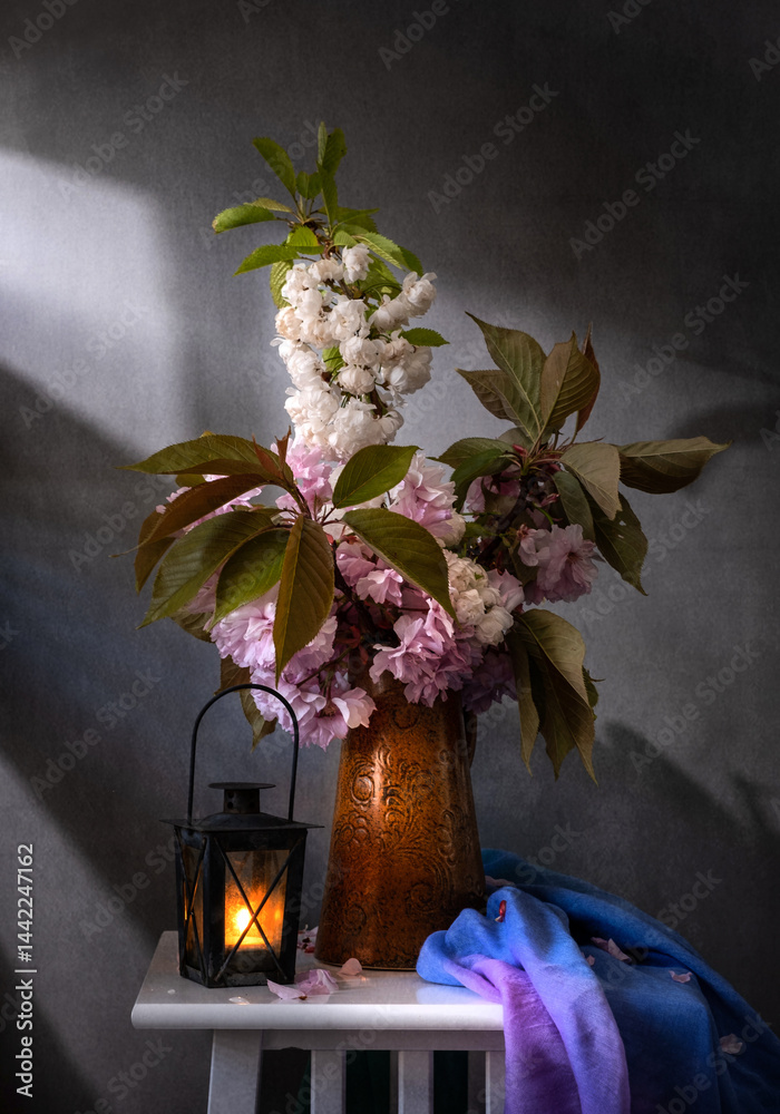 This is a Beautiful Spring Floral Arrangement that features a Lantern and Cozy Drapery elements