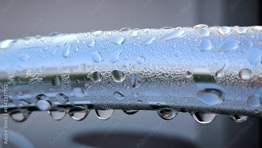 water drops om metal surface close up