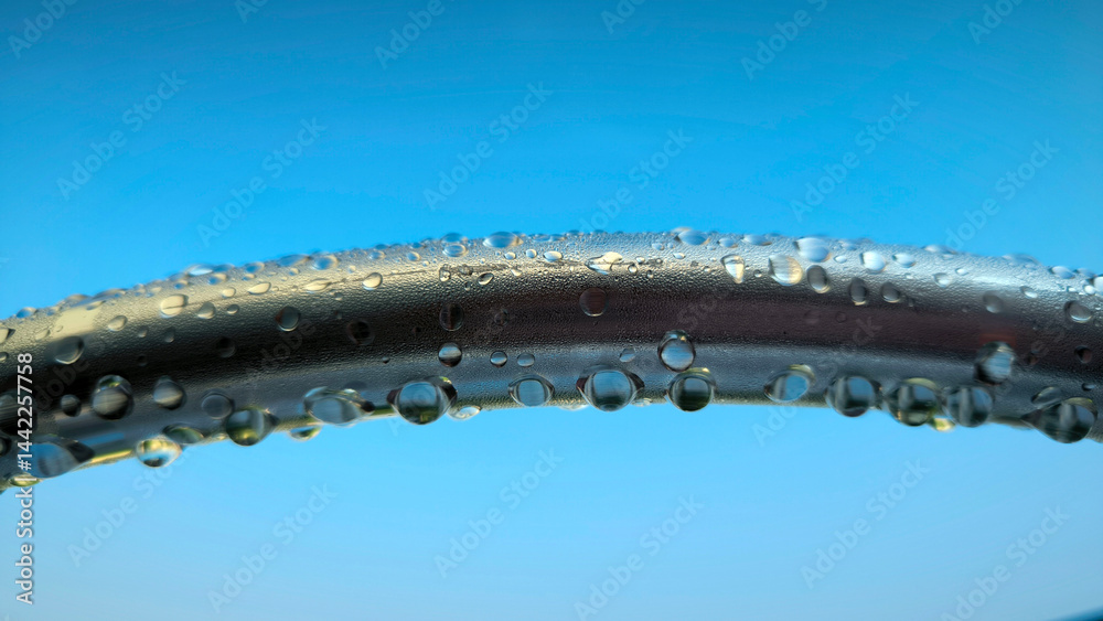 water drops om metal surface close up