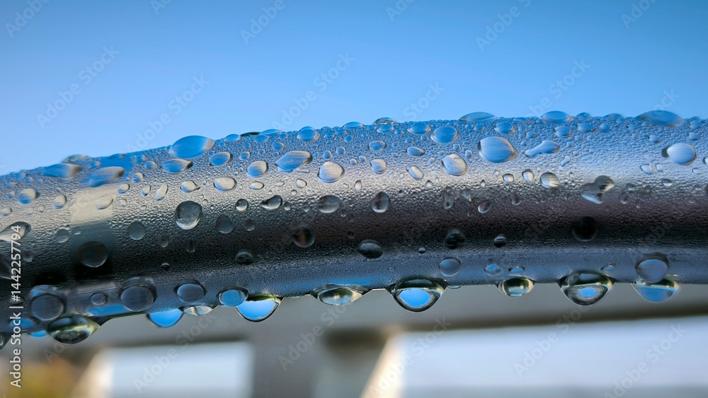 water drops om metal surface close up