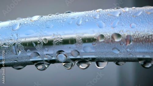 water drops om metal surface close up