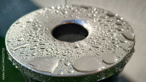 water drops om metal surface close up