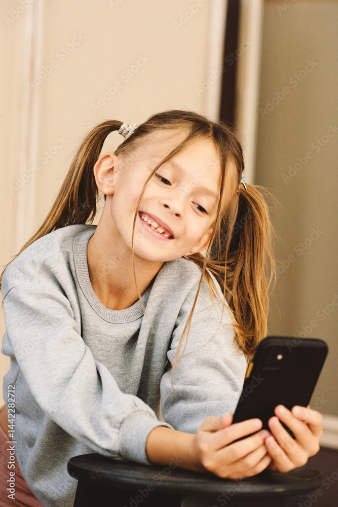 Joyful Girl with Pigtails Capturing Memories and Expressing Happiness through a Smartphone Device Joyful Girl with Pigtails Capturing Memories and Expressing Happiness through a Smartphone Device