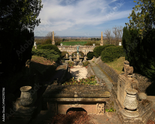 Obraz na płótnie Fountain garden terrace of Roseburg in Germany with stone sculptures and trimmed hedges under a clear spring sky w salonie