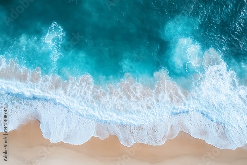 Stunning aerial view of turquoise ocean waves crashing on a pristine sandy beach with a vibrant tranquil seascape