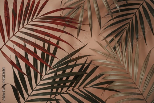 palm leaves in various shades of red black and beige.