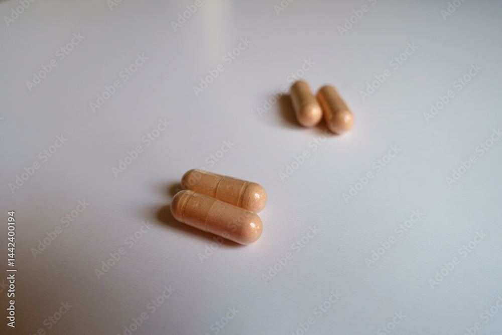2 pairs of pink capsules of palmitoylethanolamide dietary supplement