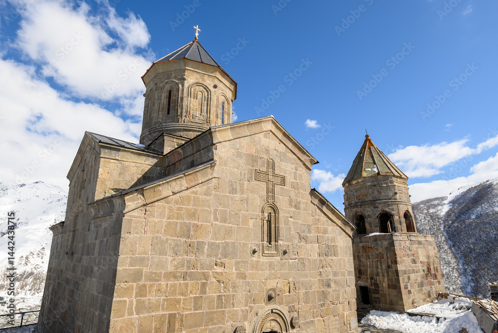 Fototapeta premium Gergeti Trinity Church near the village of Stepantsminda, popular tourist destination in the Caucasus in Georgia
