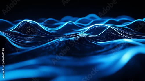Dynamic blue waves ripple through a dark environment, showcasing an enchanting interplay of light and movement. This captivating visual display invites viewers into a tranquil, immersive world
