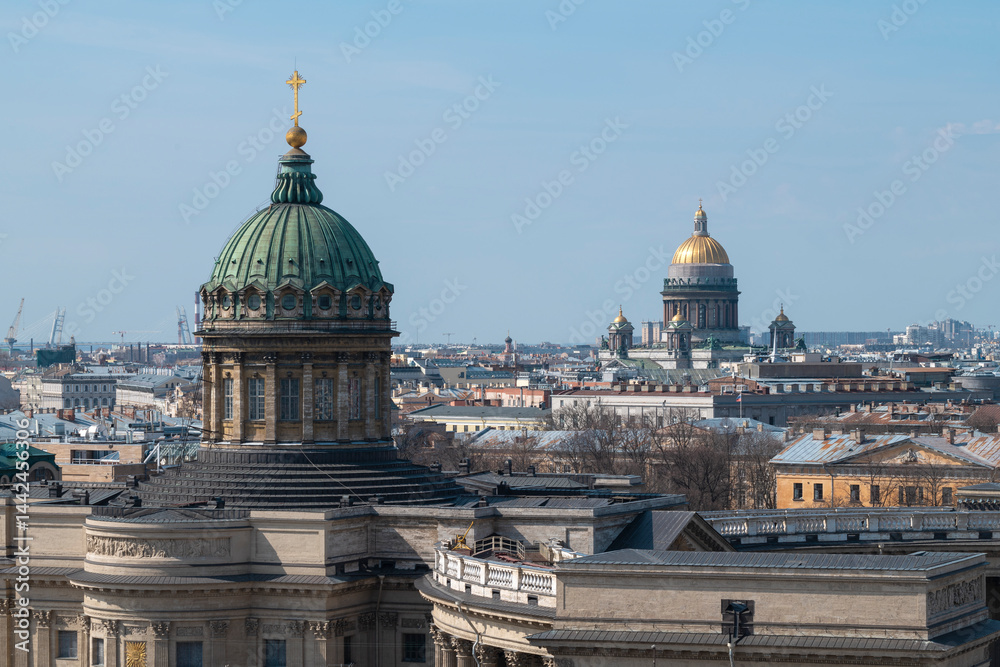 The domes of Kazan and St. Isaac's Cathedrals in the cityscape on a sunny April day. Saint Petersburg, Russia