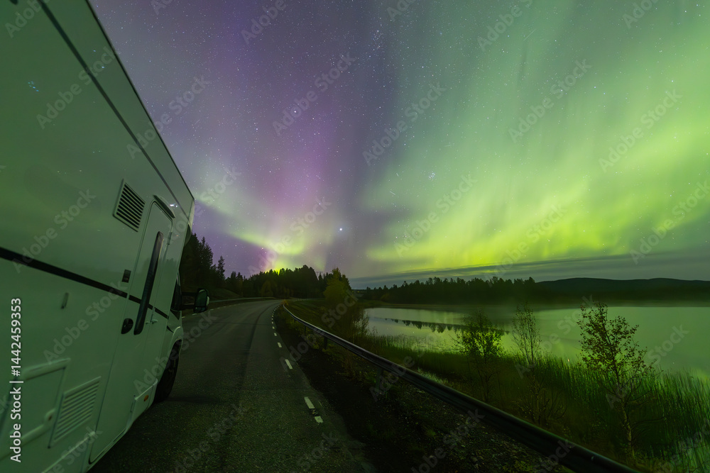 Motorhome and northern lights in Kiruna, Sweden.