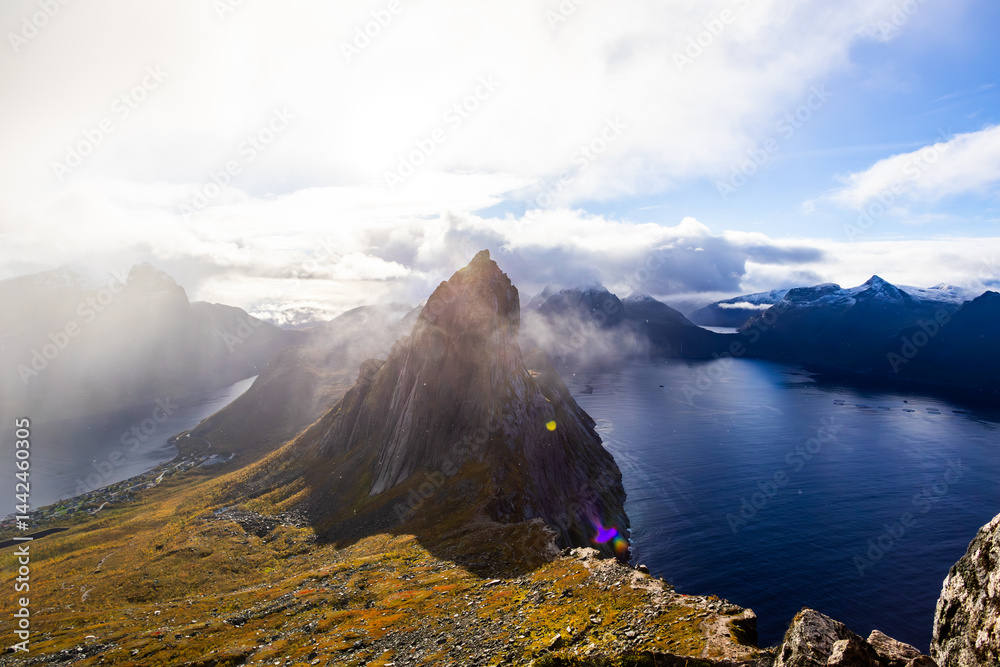 Stunning autumn landscape of Segla Mountain in Senja Island, Northern Norway, with dramatic cliffs and fjords.