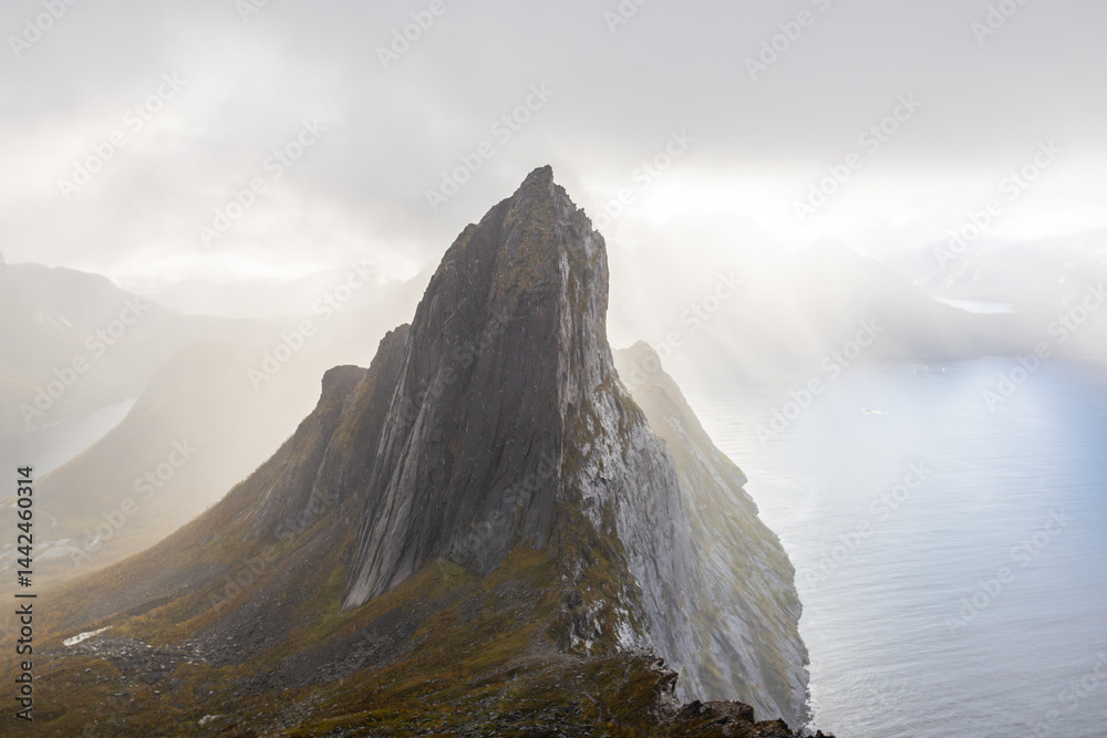 Stunning autumn landscape of Segla Mountain in Senja Island, Northern Norway, with dramatic cliffs and fjords.