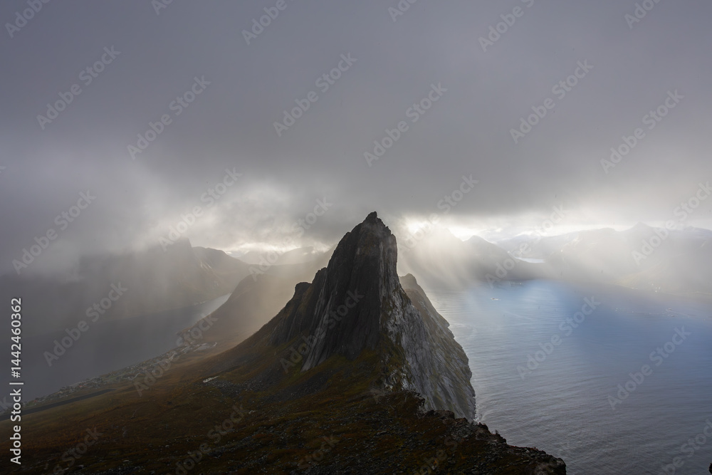 Stunning autumn landscape of Segla Mountain in Senja Island, Northern Norway, with dramatic cliffs and fjords.