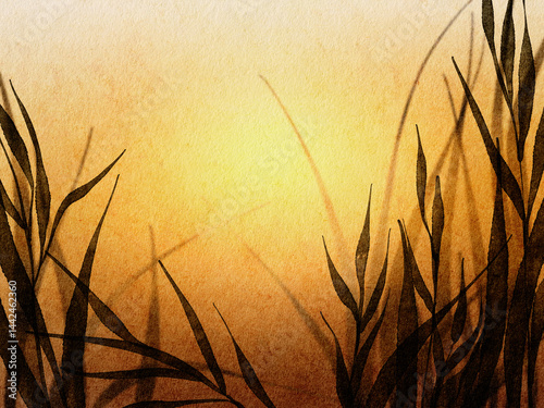 Golden sunset over tall grass creating a serene atmosphere in a tranquil countryside setting