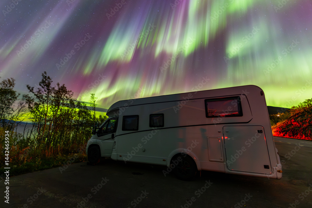 Motorhome and northern lights in Kiruna, Sweden.