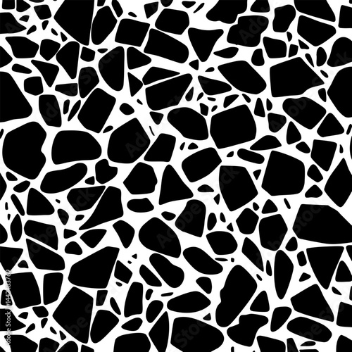 Bold black stone fragments of varying size scattered on white, forming a dense terrazzo-style pattern