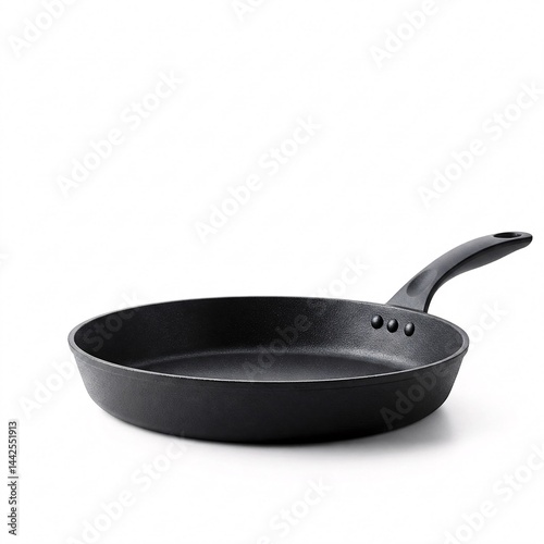Black cast-iron skillet isolated on white background. Kitchenware for frying close-up