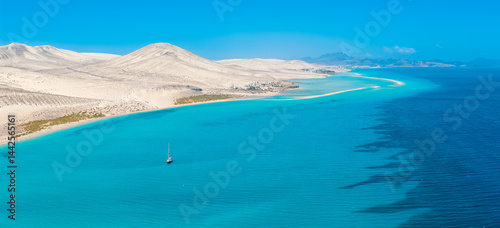 Stunning high aspect aerial panoramic view of the beautiful tropical looking beach, lagoon and sand dunes at Sotavento Risco del Paso beach near Costa Calma on Fuerteventura Canary Islands Spain