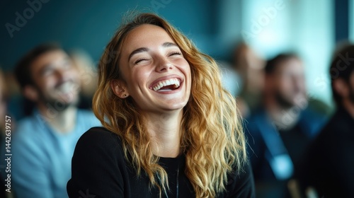 A woman with beautiful curls bursts into laughter in a lively gathering, radiating pure joy and happiness while engaging in conversations, embodying the essence of good times.
