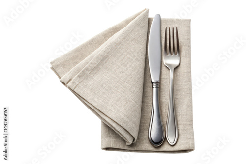 Elegant silver cutlery set placed on a folded linen napkin isolated with transparent background