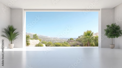 Spacious, bright interior with panoramic ocean view.  A minimalist, modern space showcases a large window offering a stunning vista of a Mediterranean landscape.  Empty room ready for furniture