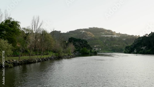 Wallpaper Mural Still Douro River flows past trees and hills in Cinfães Portugal during soft dusk light Torontodigital.ca