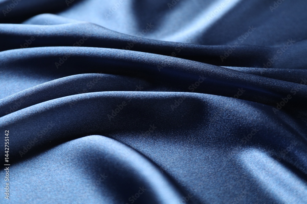Fototapeta premium Blue crumpled silk fabric as background, closeup