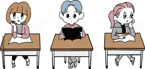 机に座る学生3人