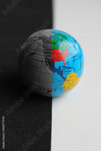 Photos North and South America on a Small Globe with Trade Routes Splitted with Straigh