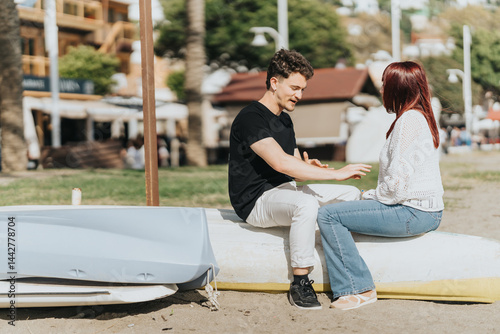 A couple exchanging smiles and connecting on a sunny day near the beach, enjoying their outdoor vacation amidst a relaxed, serene atmosphere.