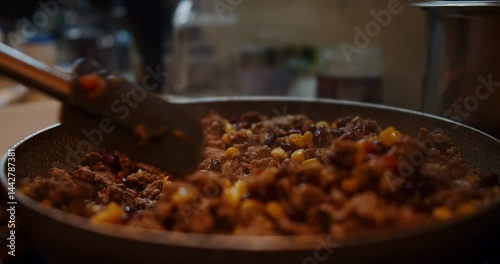 A chef showcases how to prepare a delicious chili in this video
