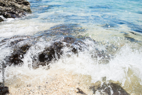 Fototapeta Naklejka Na Ścianę i Meble -  Beautiful sea wave splashing on the rocks in the summer.