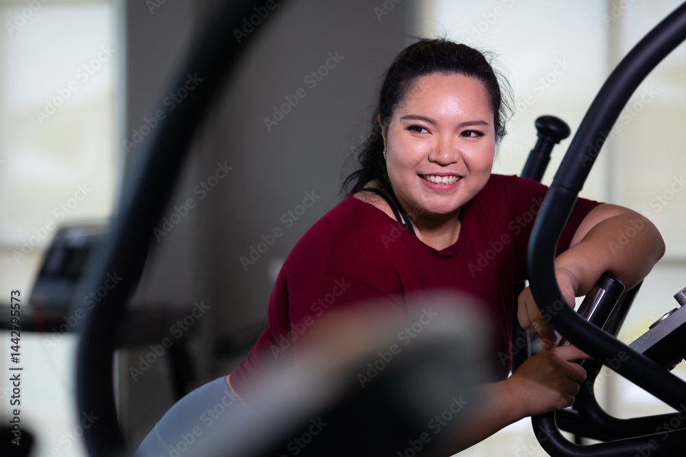 Portrait woman Exercise. beautiful young chubby overweight woman wearing sporty fitness clothes doing exercise indoors at gym fitness sport club, body and health care