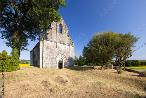 Obraz na płótnie Ancient church standing in Saint Astier, Lot et Garonne, France, during sunny summer day w salonie