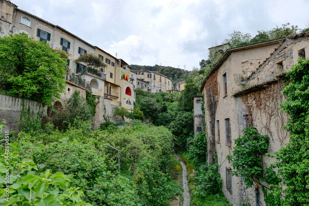 Old houses in the green vegetation in pIedimonte Matese, a town in Campania in Italy.