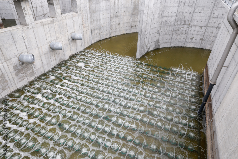 Biological treatment process in aeration basin closeup. Specialized equipment serves for breakdown of organic pollutants by infusion of oxygen