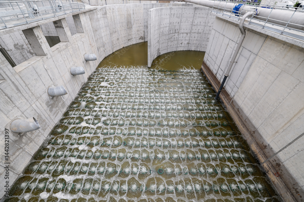 Biological treatment process in aeration basin closeup. Specialized equipment serves for breakdown of organic pollutants by infusion of oxygen