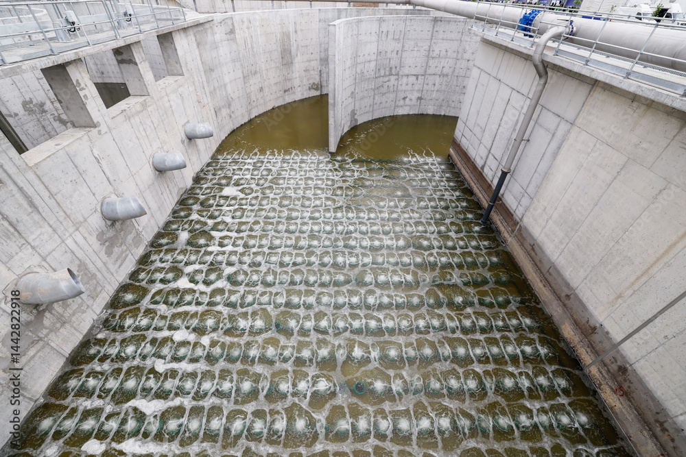 Biological treatment process in aeration basin closeup. Specialized equipment serves for breakdown of organic pollutants by infusion of oxygen